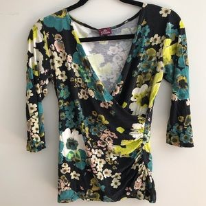 Salaam brand 3/4 sleeve V-neck wrap top.